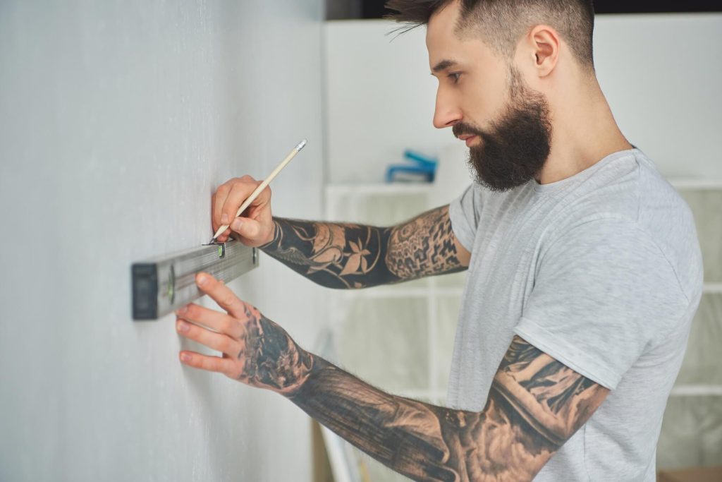 man using level tool